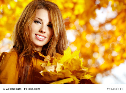 Autumn woman on leafs background